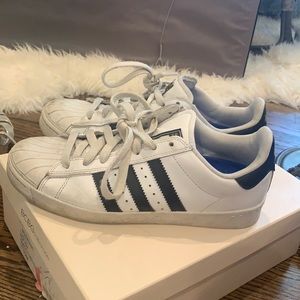 White and black Addidas tennis shoes